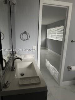 bathroom with tile floors and double sink