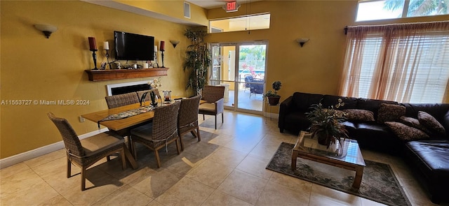 dining area featuring light tile patterned floors