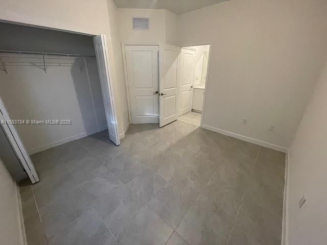 unfurnished bedroom featuring a closet