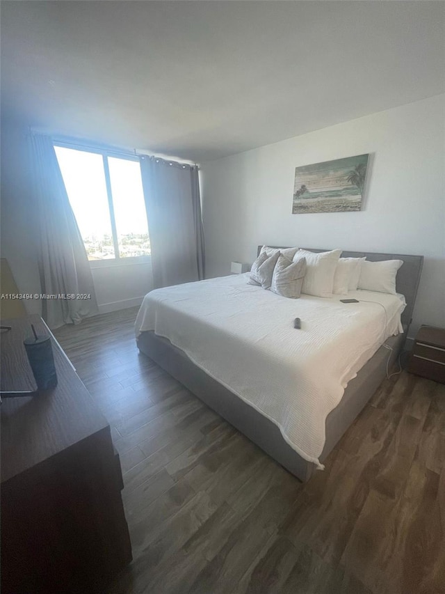 bedroom featuring dark hardwood / wood-style flooring