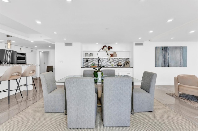 dining area featuring light wood-type flooring