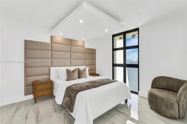 bedroom featuring floor to ceiling windows