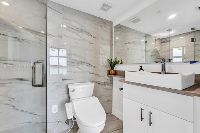 bathroom with tile walls, tile floors, a shower with door, toilet, and oversized vanity