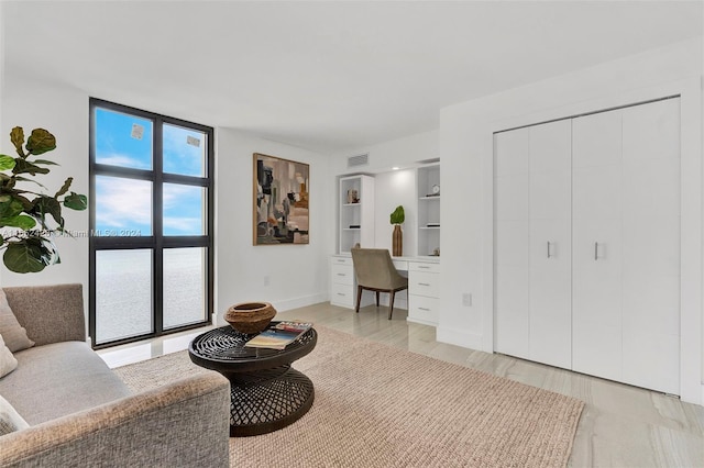 interior space with plenty of natural light and floor to ceiling windows