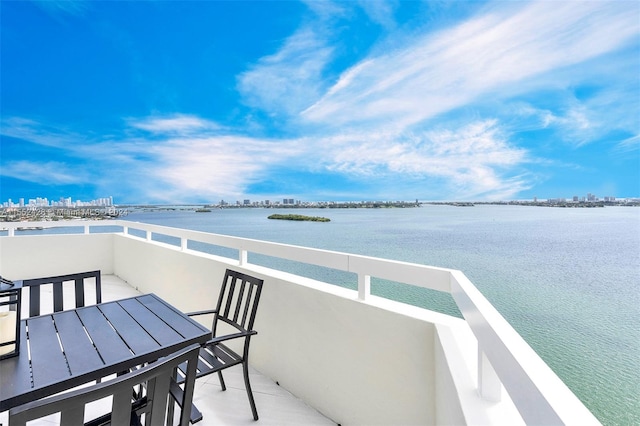 balcony featuring a water view