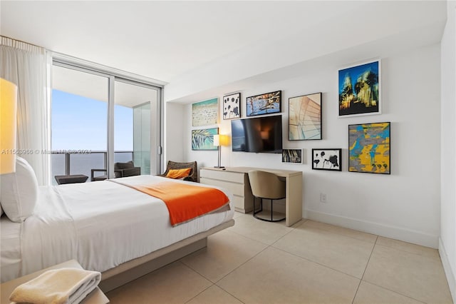 bedroom featuring floor to ceiling windows, light tile floors, a water view, and access to outside