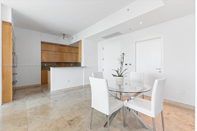 view of tiled dining space