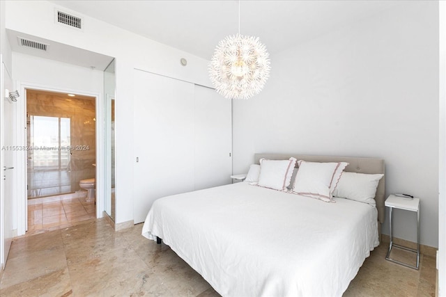 bedroom with light tile flooring and an inviting chandelier