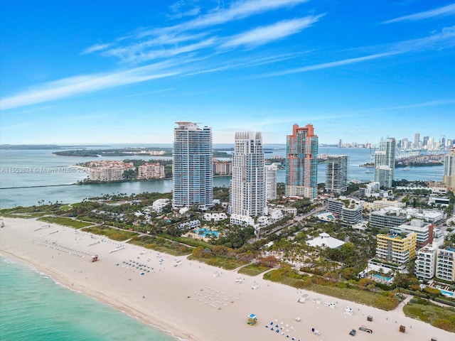 bird's eye view with a beach view and a water view