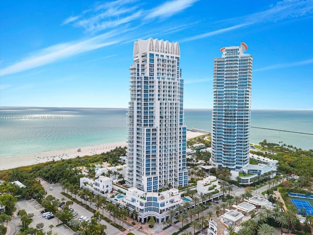 exterior space with a water view and a view of the beach