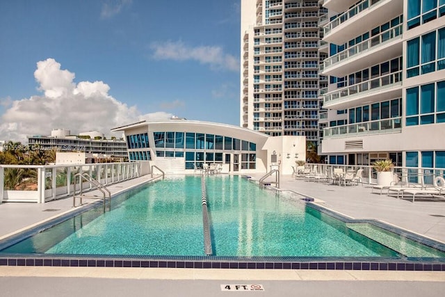 view of swimming pool with a patio area