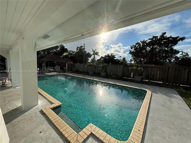 view of pool featuring a gazebo, a fenced in pool, a patio, and a fenced backyard