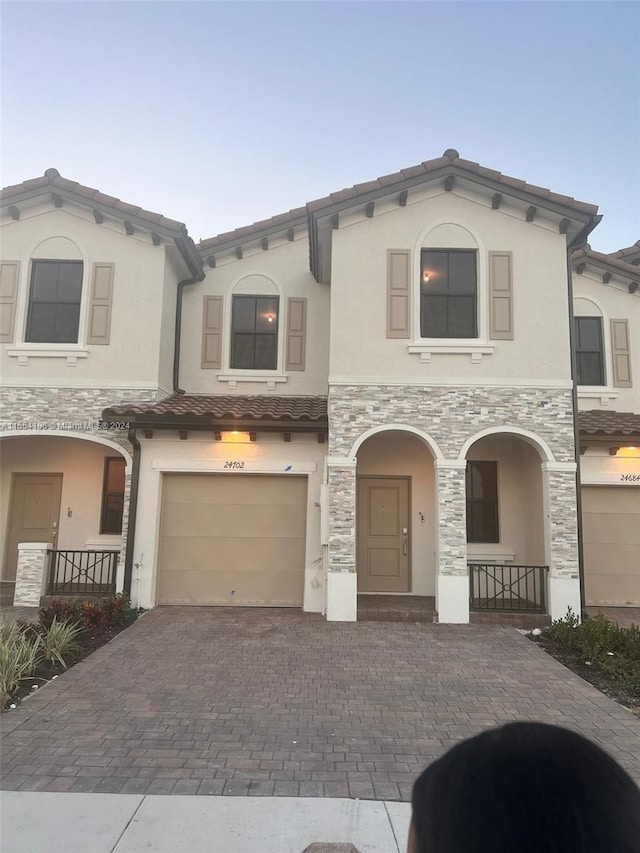 mediterranean / spanish house featuring a garage