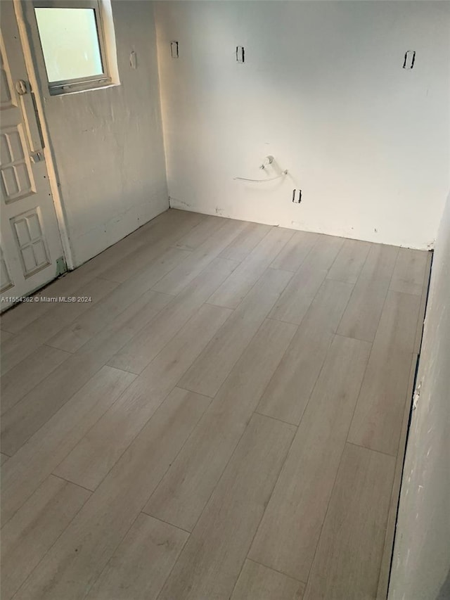 spare room featuring hardwood / wood-style flooring