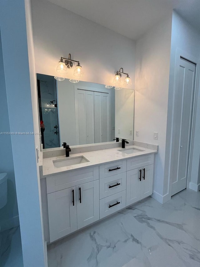 bathroom with tile flooring, toilet, and dual bowl vanity