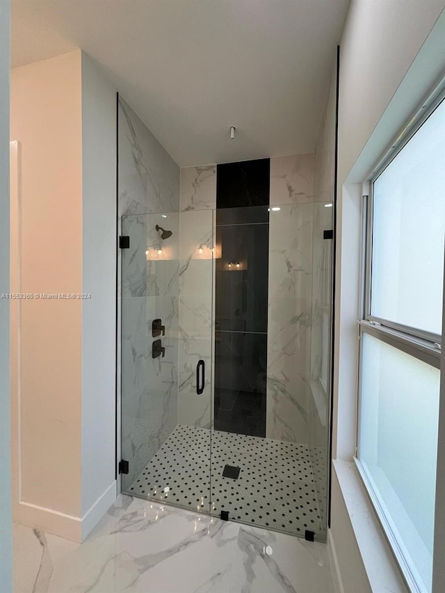 bathroom with tile flooring and a shower with shower door