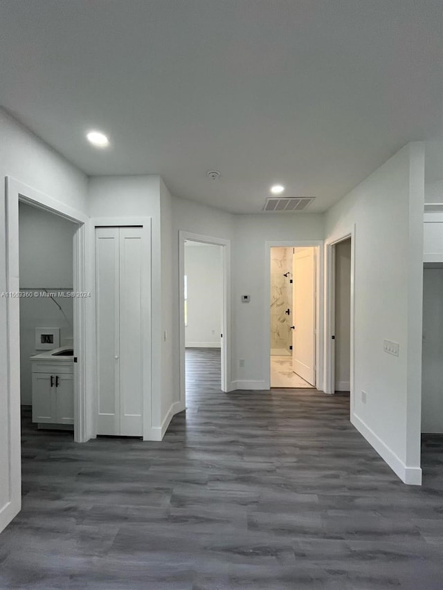 spare room featuring dark wood-type flooring