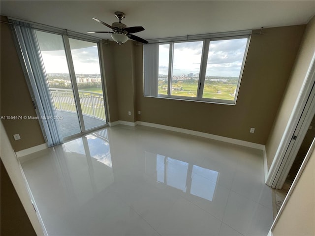 tiled empty room with ceiling fan