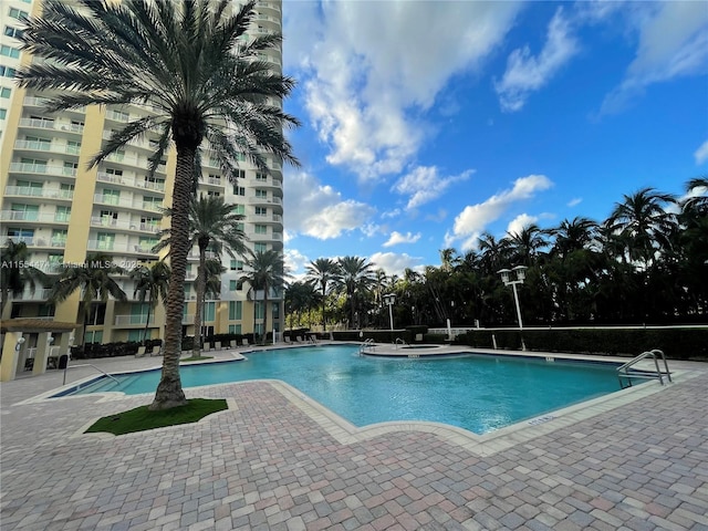 view of swimming pool featuring a patio