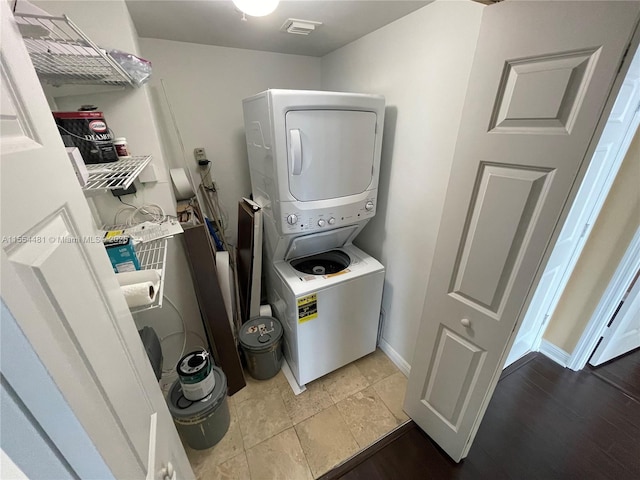 laundry room with stacked washer and clothes dryer