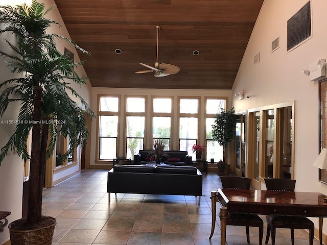 tiled living room with high vaulted ceiling, wooden ceiling, ceiling fan, and french doors