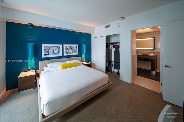 carpeted bedroom featuring a closet