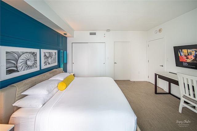 carpeted bedroom with a closet