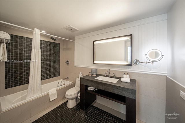 full bathroom featuring tile patterned floors, toilet, shower / tub combo, and vanity