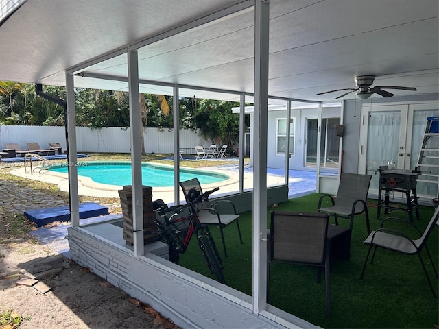 view of swimming pool featuring ceiling fan and a patio