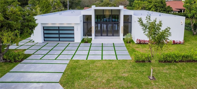 exterior space with a lawn and a garage