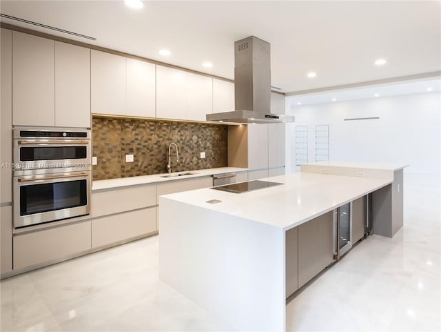 kitchen featuring sink, a center island, stainless steel double oven, and island range hood