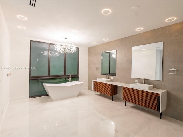 bathroom featuring a chandelier, tile walls, double vanity, and tile flooring