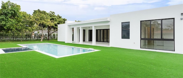 view of swimming pool featuring a yard and a patio area