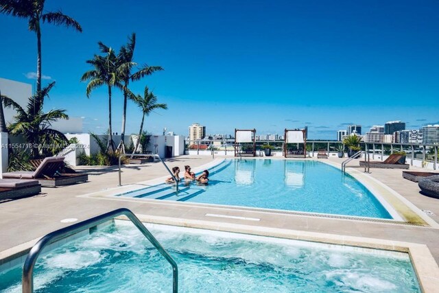 view of swimming pool with a patio