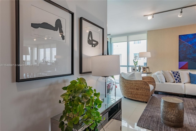 living room with light tile flooring and track lighting