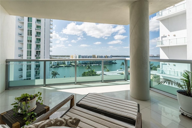 balcony featuring a water view