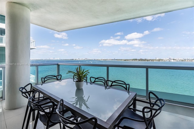 balcony featuring a water view