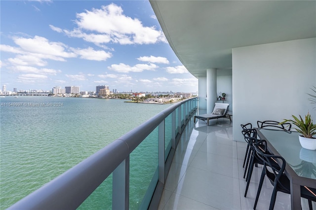 balcony featuring a water view