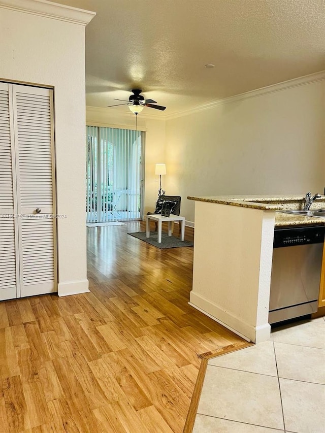 kitchen featuring light hardwood / wood-style floors, ceiling fan, a textured ceiling, crown molding, and dishwasher