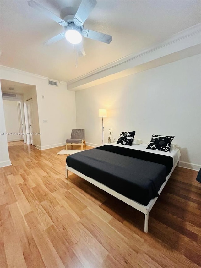 bedroom with pool table, crown molding, ceiling fan, and light hardwood / wood-style flooring