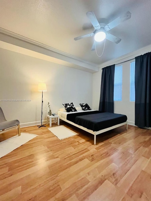 bedroom with pool table, light hardwood / wood-style floors, and ceiling fan