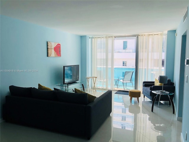 tiled living room with expansive windows