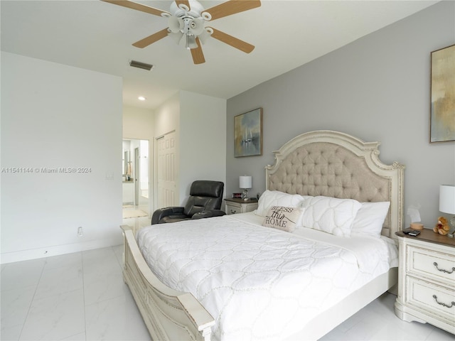 bedroom with ceiling fan, visible vents, baseboards, marble finish floor, and a closet