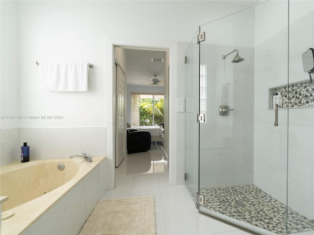 full bathroom featuring tile patterned flooring, ensuite bath, a bath, and a shower stall