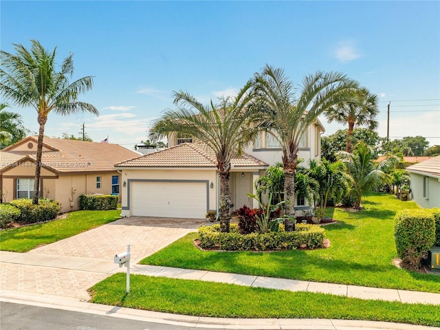 view of front of property with stucco siding, a tiled roof, an attached garage, decorative driveway, and a front yard