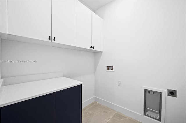 laundry area with cabinet space, baseboards, washer hookup, and hookup for an electric dryer