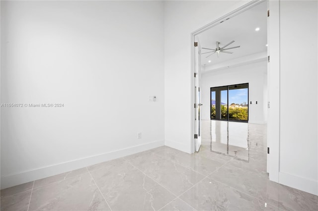 unfurnished room featuring a ceiling fan, recessed lighting, and baseboards