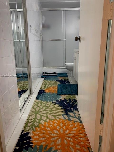 bathroom with tile flooring and vanity