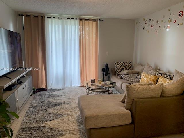 living room featuring a textured ceiling