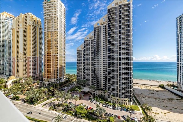 view of building exterior with a view of the beach and a water view